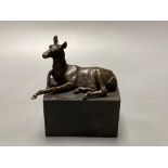 A bronze model of a recumbent mule, indistinctly signed, on marble plinth, width 12cmCONDITION: Good