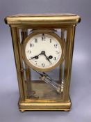A four glass and brass mantel clock with mercury pendulum, 18cm high, 17cm wide,13cm