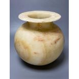 An alabaster bowl with everted rim, height 27cmCONDITION: Small repaired chip at rim,