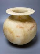 An alabaster bowl with everted rim, height 27cmCONDITION: Small repaired chip at rim,