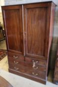 An early 19th century mahogany linen press, width 117cm height 187cmCONDITION: Lacks the original