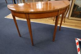 An Edwardian satinwood demi-lune console table, width 113cm height 77cmCONDITION: One or two small