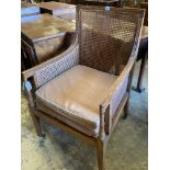 An Edwardian Regency style beech bergere armchair, with caned back and sides, width 60cmCONDITION: