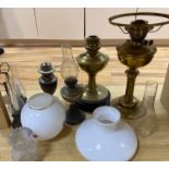 Six various oil lampsCONDITION: Condition generally good, glass shades and chimney good