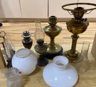 Six various oil lampsCONDITION: Condition generally good, glass shades and chimney good