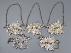 A set of three Victorian silver leaf wine labels, Yapp & Woodward, Birmingham, 1846, 7cm and one