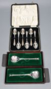 A cased set of six silver teaspoons and two single Christmas spoons