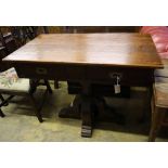 A Gothic style pitch pine two drawer side table, width 100cm depth 55cm height 83cmCONDITION: Of