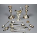 A quantity of small silver to include a pair of candlesticks, sauce ladle, cream jug etc and a