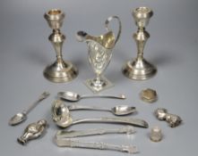 A quantity of small silver to include a pair of candlesticks, sauce ladle, cream jug etc and a