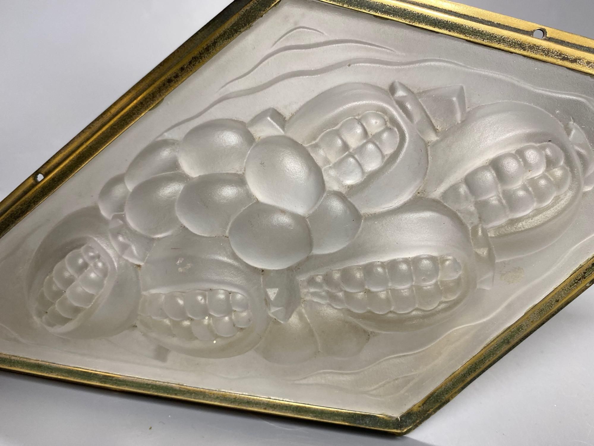 A pressed, frosted glass lozenge shape panel, within brass frame, height 35cmCONDITION: Good - Image 2 of 3