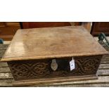A 17th century carved oak bible box, width 63cmCONDITION: Top with an old slightly slanted