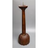 A carved hardwood pricket candlestick, height 58cm