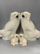 A large pair of Victorian Staffordshire pottery comforter spaniels, 39cm and a pair of Royal Doulton