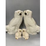 A large pair of Victorian Staffordshire pottery comforter spaniels, 39cm and a pair of Royal Doulton