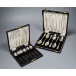 A 1930's cased set of six 'bean end' silver coffee spoons and a later set of six silver grapefruit