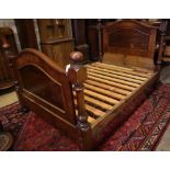 A Victorian mahogany three quarter size head and foot bedstead, width 137cmCONDITION: Wear to the