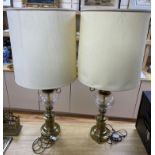 A pair of Art Nouveau style brass lamps, total height 67cmCONDITION: Both require re-wiring and
