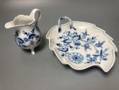 A Meissen blue and white onion pattern jug and a similar leaf shaped pickle dish (2)CONDITION: