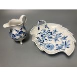 A Meissen blue and white onion pattern jug and a similar leaf shaped pickle dish (2)CONDITION: