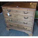 An Edwardian Georgian style mahogany chest with brushing slide and four graduated long drawers, on
