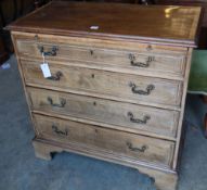 An Edwardian Georgian style mahogany chest with brushing slide and four graduated long drawers, on