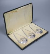 A cased set of three silver wine labels by Daniel & John Welby, London, 1911, 5cm, 29 grams, of