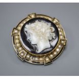 A 19th century gold (tests as 14ct), enamel and pearl target pendant brooch, centred by an onyx