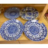 Four Chinese Kangxi period blue and white dishes and a Qianlong blue and white dishCONDITION: Pair