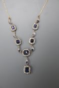 A Victorian yellow metal white and blue sapphire cluster set drop pendant necklace, approx. 80cm,