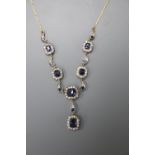 A Victorian yellow metal white and blue sapphire cluster set drop pendant necklace, approx. 80cm,