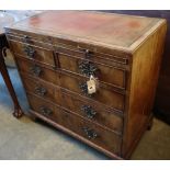 A George I walnut chest, with brushing slide, two short and three graduated long drawers, width