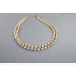 A modern stylish 750 yellow metal and white opal set necklace, 51cm and pair of matching drop