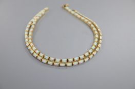 A modern stylish 750 yellow metal and white opal set necklace, 51cm and pair of matching drop