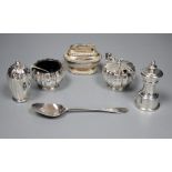 A silver mounted peppermill, a Garrard & Co silver three piece condiment set, a Victorian silver