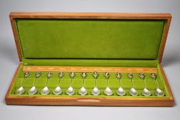 A modern cased set of twelve RHS parcel gilt silver flower spoon set.