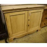 A Victorian pine two door cupboard, width 114cm depth 44cm height 89cm