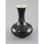 A Chinese black glazed bottle vase, possibly 18th century, 17cm highCONDITION: Chip to foot rim,