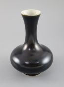 A Chinese black glazed bottle vase, possibly 18th century, 17cm highCONDITION: Chip to foot rim,