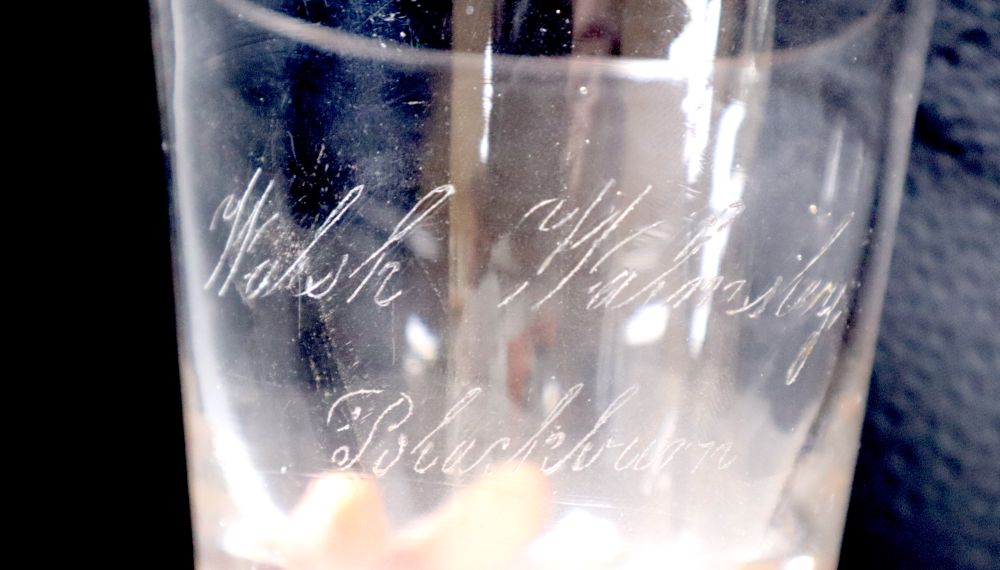 A heavy Victorian glass tumbler, engraved 'Walsh, Walmsley Blackburn' c.1840, 11.6cm - Image 2 of 2