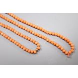A single strand coral bead necklace, with yellow metal spacer, 197cm, gross weight 56 grams,