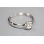 A modern 18ct white gold and diamond cluster ring, size O, gross 1.6 grams.CONDITION: Central