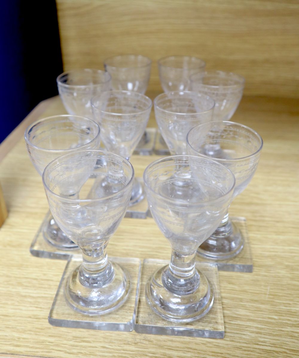 A set of ten George III 'oxo' engraved firing glasses, c.1800, square plinth bases, 10.5cm