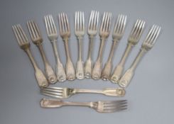 A matched set of twenty two George IV and later silver fiddle, thread and shell pattern dessert