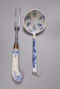 A Bow pistol grip blue and white handled fork, c.1770, 23cm, and a Continental porcelain blue and