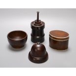 A 19th century lignum vitae turret shaped jar and cover, a similar acorn shaped string box and bowl,