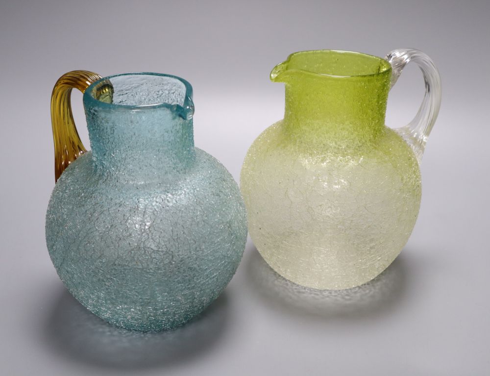 Two Victorian crackle glass jugs, late 19th century, one in turquoise glass with applied amber