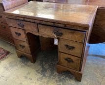 A walnut kneehole dressing table/desk, incorporating antique timbers, width 95cm height