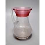 A Victorian 'E. Oakes 1887' etched commemorative jug, with red trailing to the neck, 16.5cm