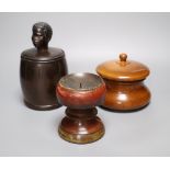 A 19th century ash jar and cover, a beech tobacco jar and a painted beech pricket candlestick, 11.